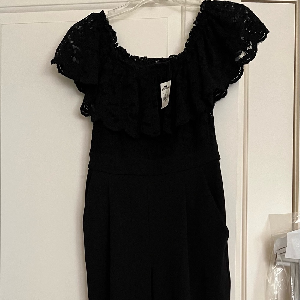 Express black jumpsuit with lace detail. New -  has tags. Size 4.